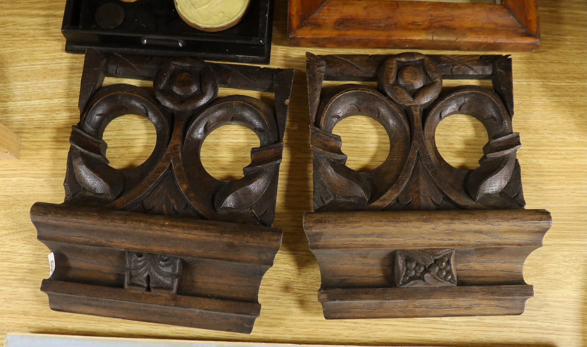 A group of Object d'Art to include Grand tour souvenir plaster roundels, a wax profile portrait, pair of carved oak cornice sections, a moulded plaster frieze etc